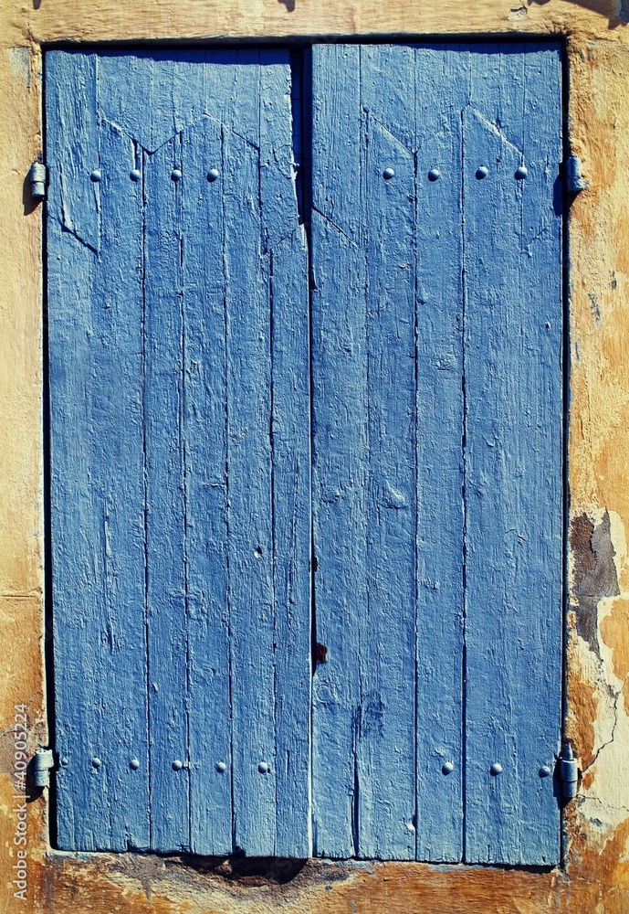 Old blue window shutters. Old blue window shutters.