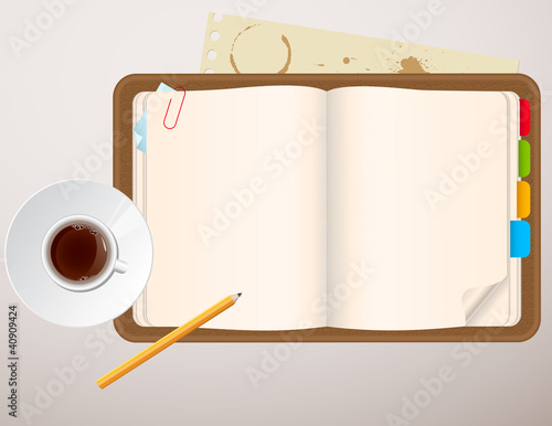 notebook and a cup of coffee