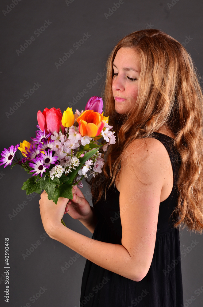 Springtime: young woman with a colorful bouquet of flowers Springtime: young woman with a colorful bouquet of flowers
