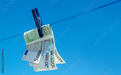 euro money banknotes hanging on clothesline photo