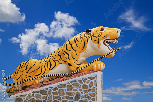 statue tiger on blue sky