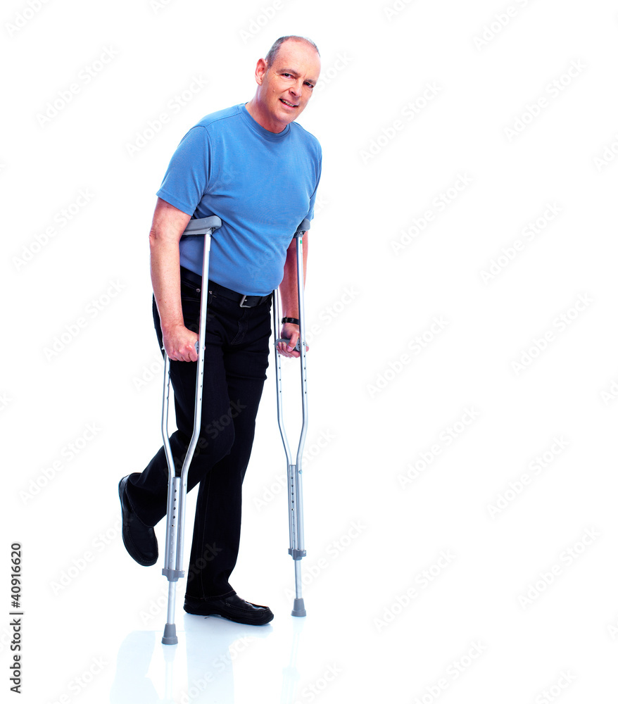 Man with crutch. Man with crutch.