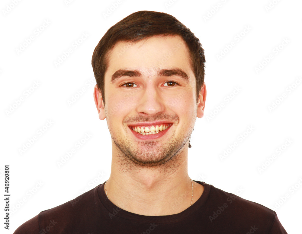 Obraz premium Closeup portrait of a young smiling guy, isolated on white