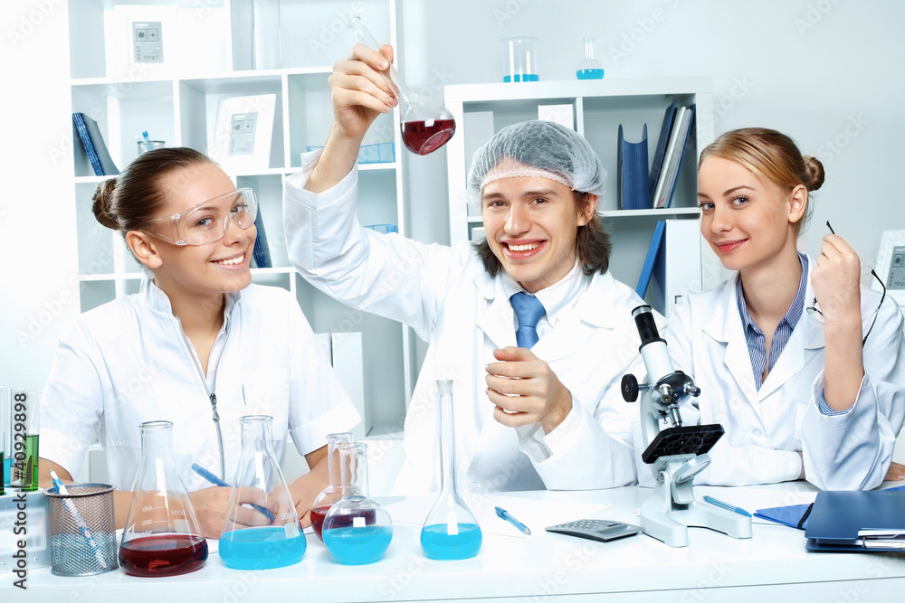 Young scientists working in laboratory Young scientists working in laboratory