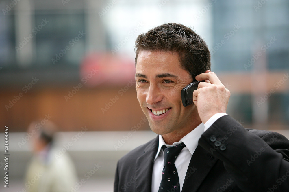 Young businessman making a call outside Young businessman making a call outside