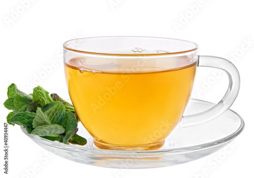 Glass cup of tea with mint isolated on white