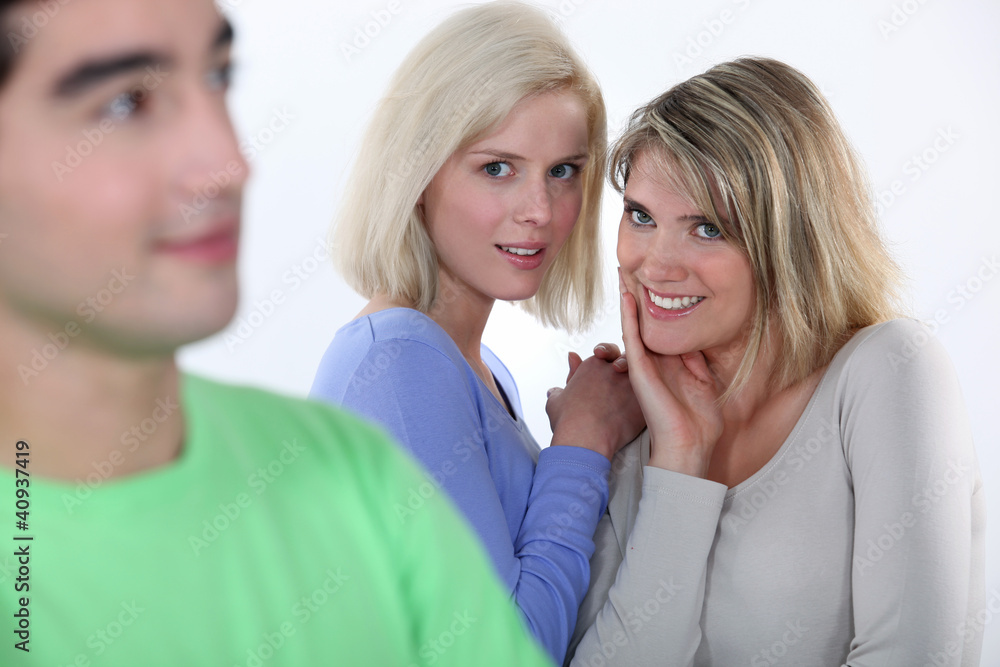 Girls gossiping about a boy Girls gossiping about a boy