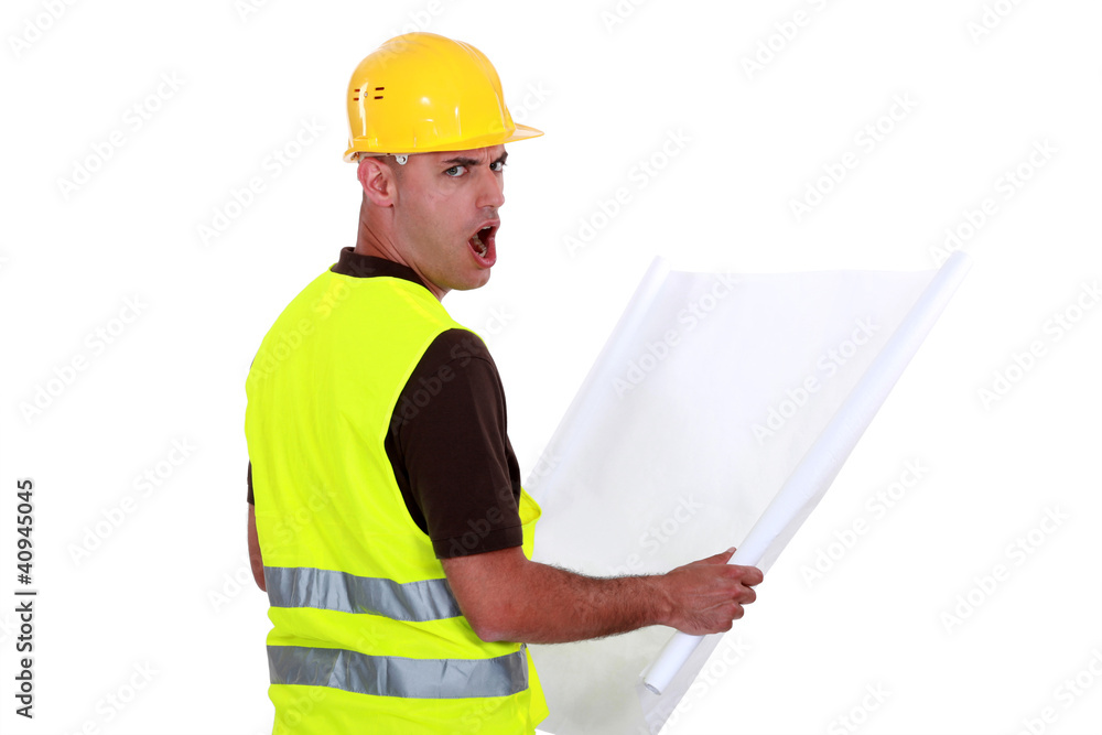 Worker open mouthed in disbelief Worker open mouthed in disbelief
