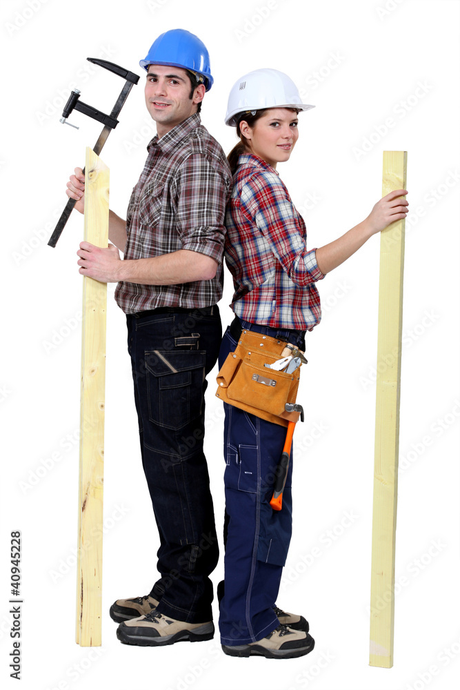 Tradespeople holding tools and materials Tradespeople holding tools and materials