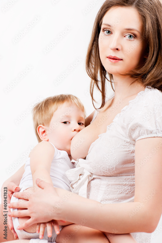 Mom is breastfeeding, on a gray background Mom is breastfeeding, on a gray background