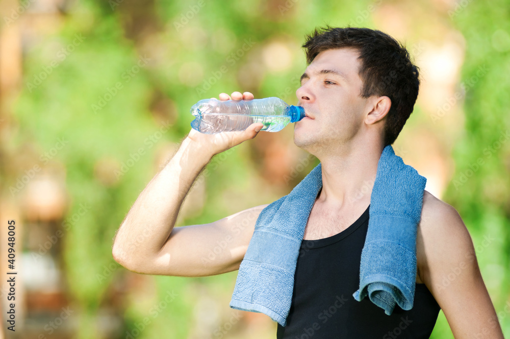 Man drinking water after fitness Man drinking water after fitness