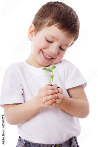Boy with sprouts in hands