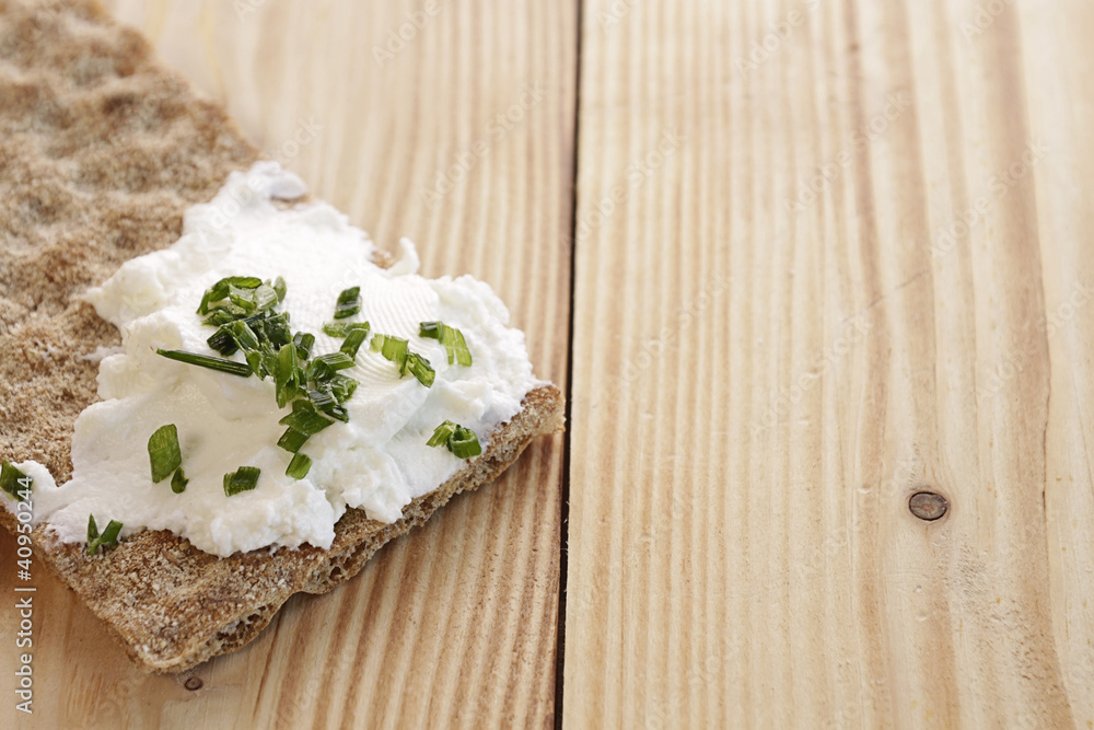 Whole grain bread with curd and chives