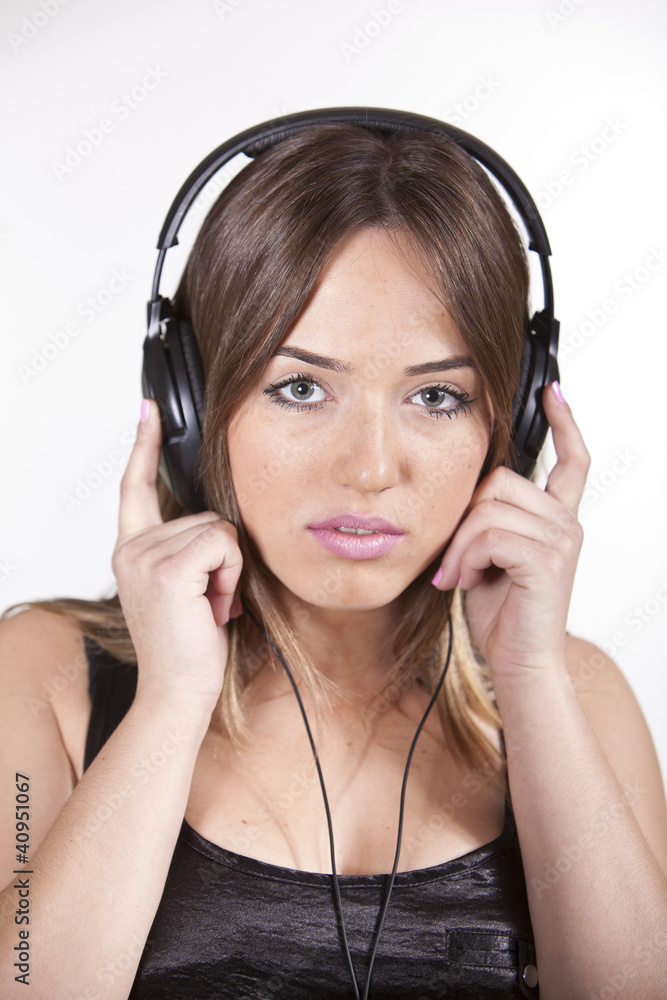 Beautiful cheerful young woman enjoying music Beautiful cheerful young woman enjoying music