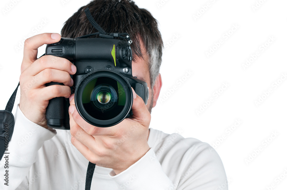 Young man with camera, isolated on white background, focus is on Young man with camera, isolated on white background, focus is on