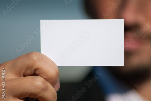 Man holding blank business card