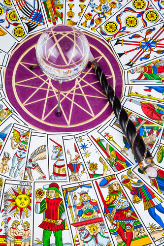 Tarot cards in circle with a magic ball and wand in the center