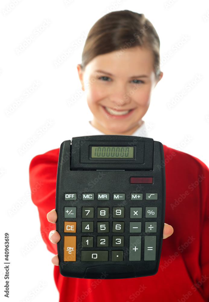 Smiling school girl showing digital calculator Smiling school girl showing digital calculator