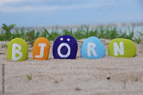 Bjorn, male name on colourful pebbles photo