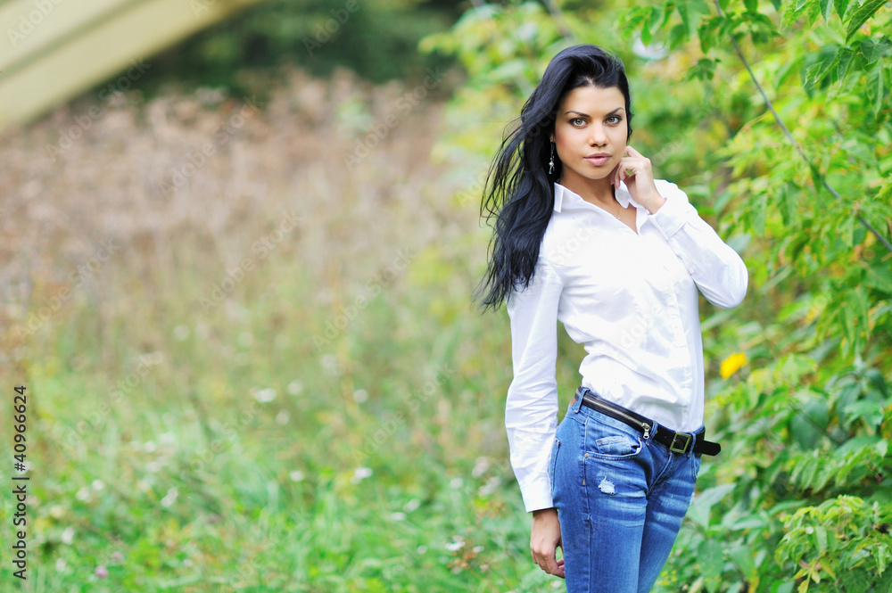 Beautiful young woman posing outdoors Beautiful young woman posing outdoors