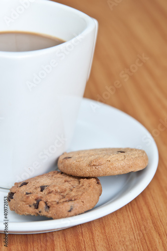 coffee cup with cookie .