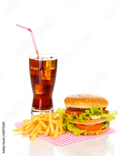 Big and tasty hamburger and fried potatoes with cola isolated