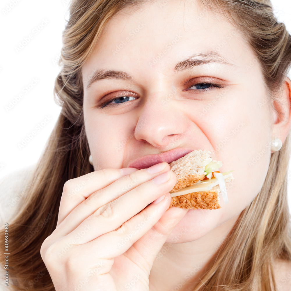 Woman enjoying eating sandwich
