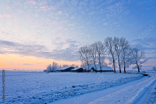Farm in a white winter landscape