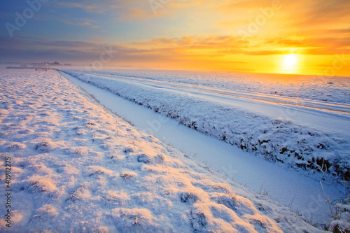 Grassland in winter at sunset