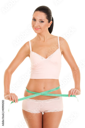 happy young woman with measure tape