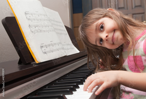 Little girl playing piano