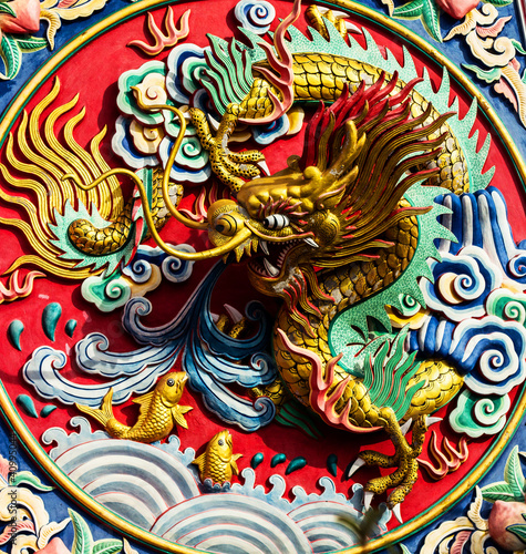 Dragon statue on the colorful wall