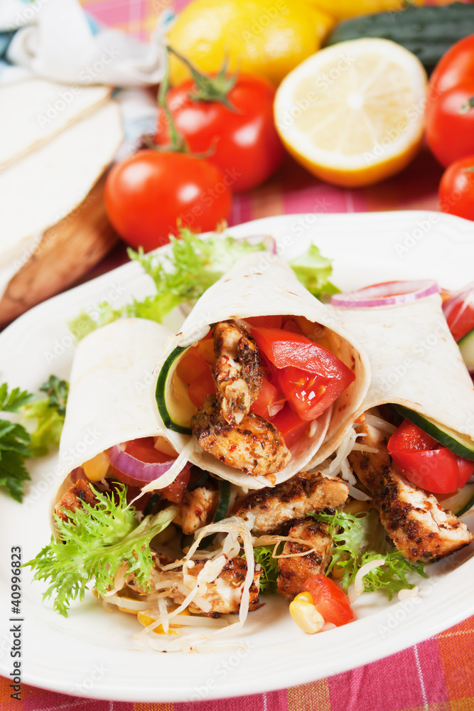 Grilled chicken and salad in tortilla wrap Grilled chicken and salad in tortilla wrap
