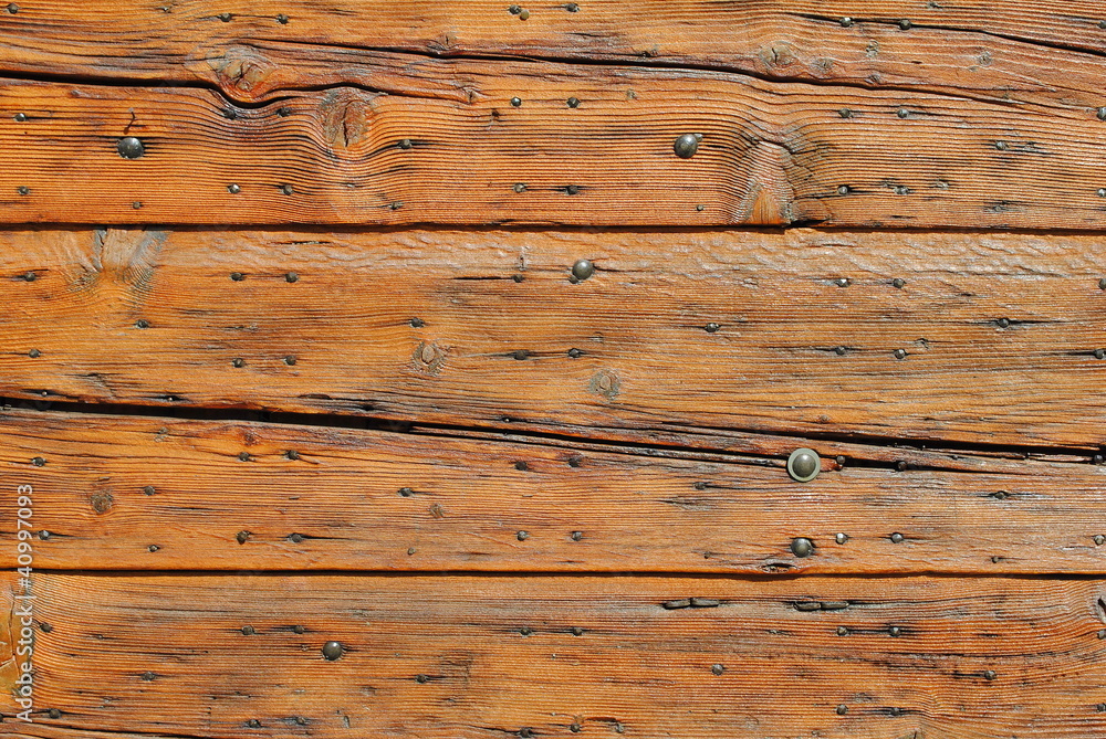Fototapeta premium old door with a striped surface, wooden background