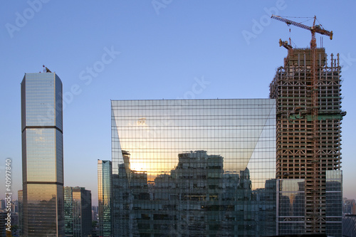 Sunset reflections in office building, Beijing, China