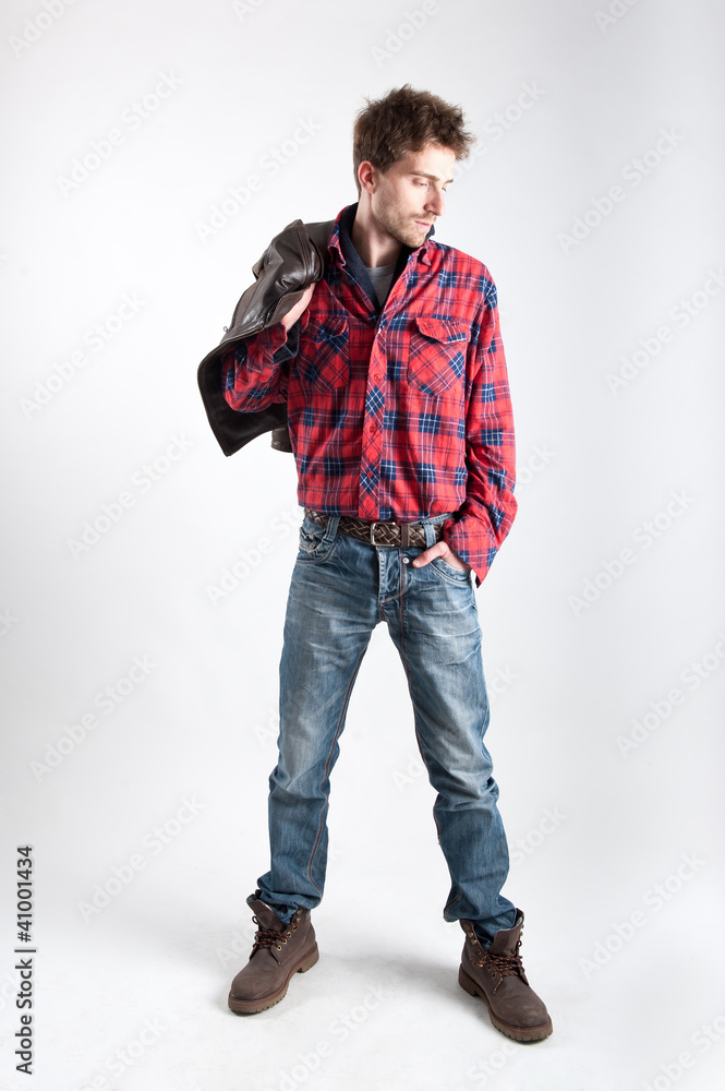 Portrait of young man with plaid shirt and leather jacket. Stock