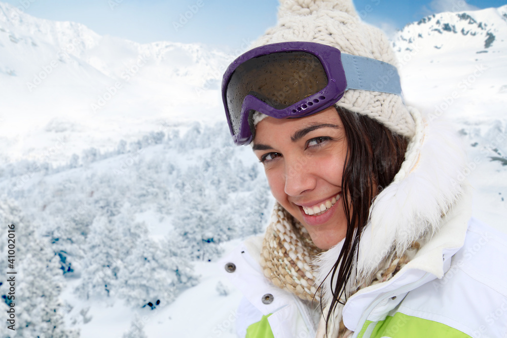 Portrait of woman at the mountain in ski outfit Portrait of woman at the mountain in ski outfit