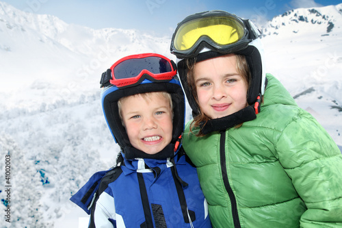 Portrait of children in ski outfit at the mountain