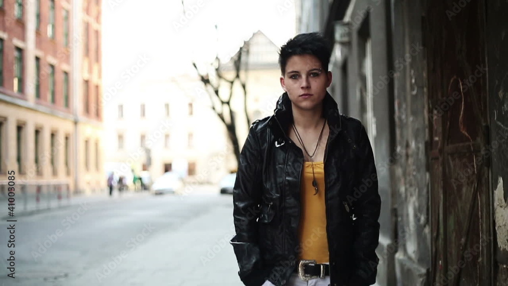 Punk girl walking in the city, slow motion, steadicam shot Punk girl walking in the city, slow motion, steadicam shot