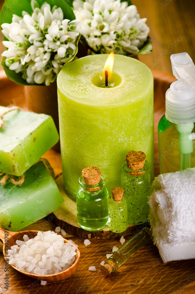 Spa still life with green candle and spring flowers Spa still life with green candle and spring flowers