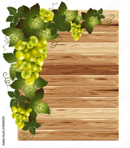 White grapes on a wooden background