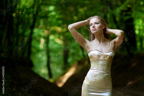 Beautiful young woman posing outdoors