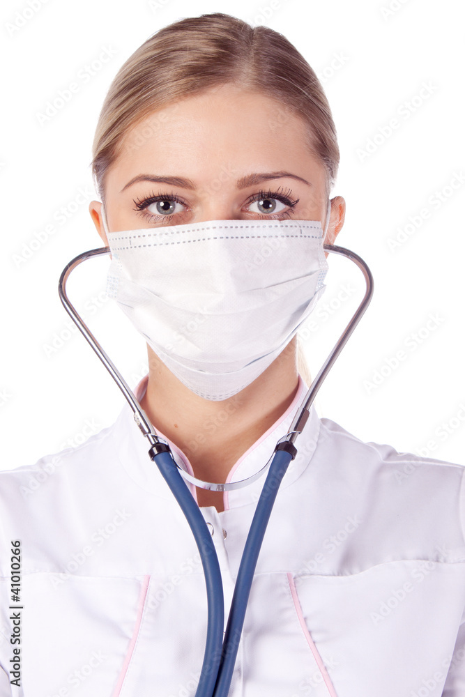 Portrait of a girl doctor in a mask. phonendoscope Portrait of a girl doctor in a mask. phonendoscope