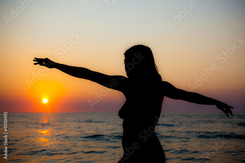 Nude Woman Silhouette at Sunset on the Beach © william87