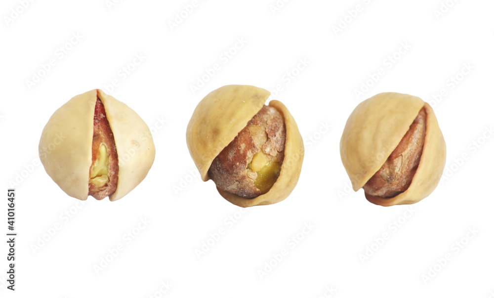 Close up of pistachios nuts in isolated white background Close up of pistachios nuts in isolated white background