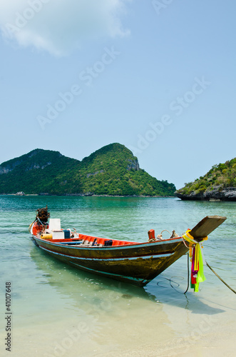long tail boat on the beach