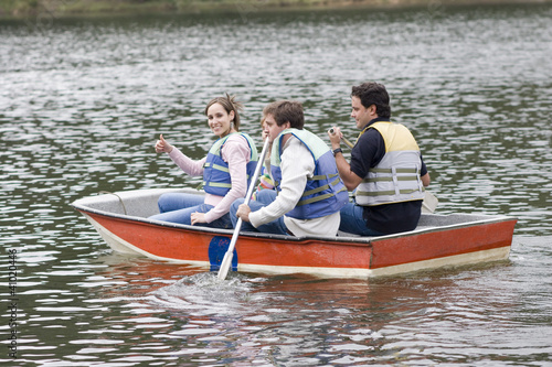 Happy Family Canoeing on Lake © Herjua