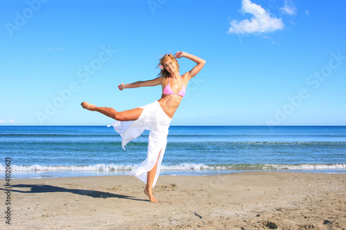 Young fashion woman on the beach