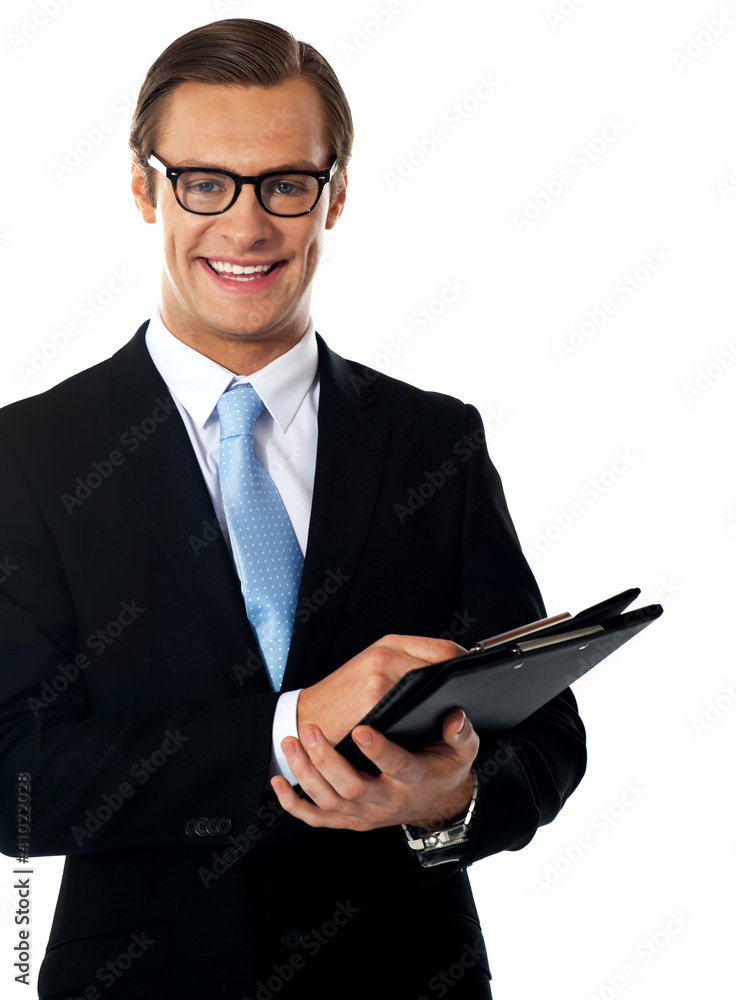 Caucasian smiling young businessman holding a folder Caucasian smiling young businessman holding a folder