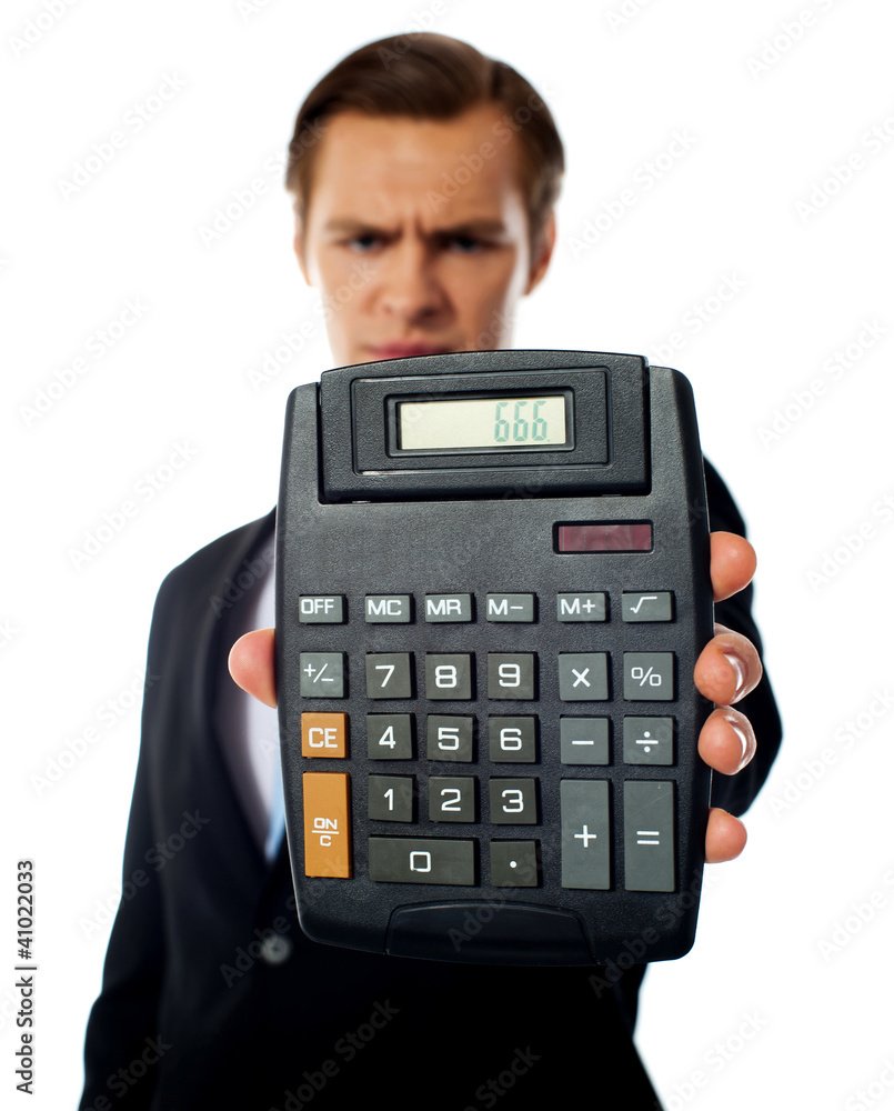 Businessman holding a calculator Businessman holding a calculator